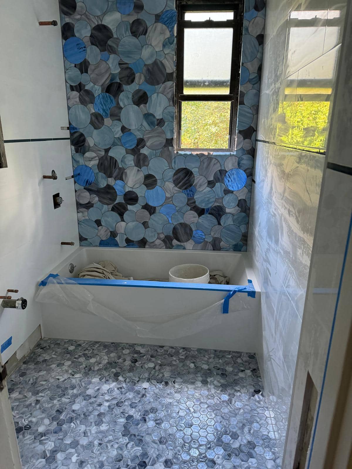 Bathroom shower niche and tile detail for a Long Island City remodeling planning guide.