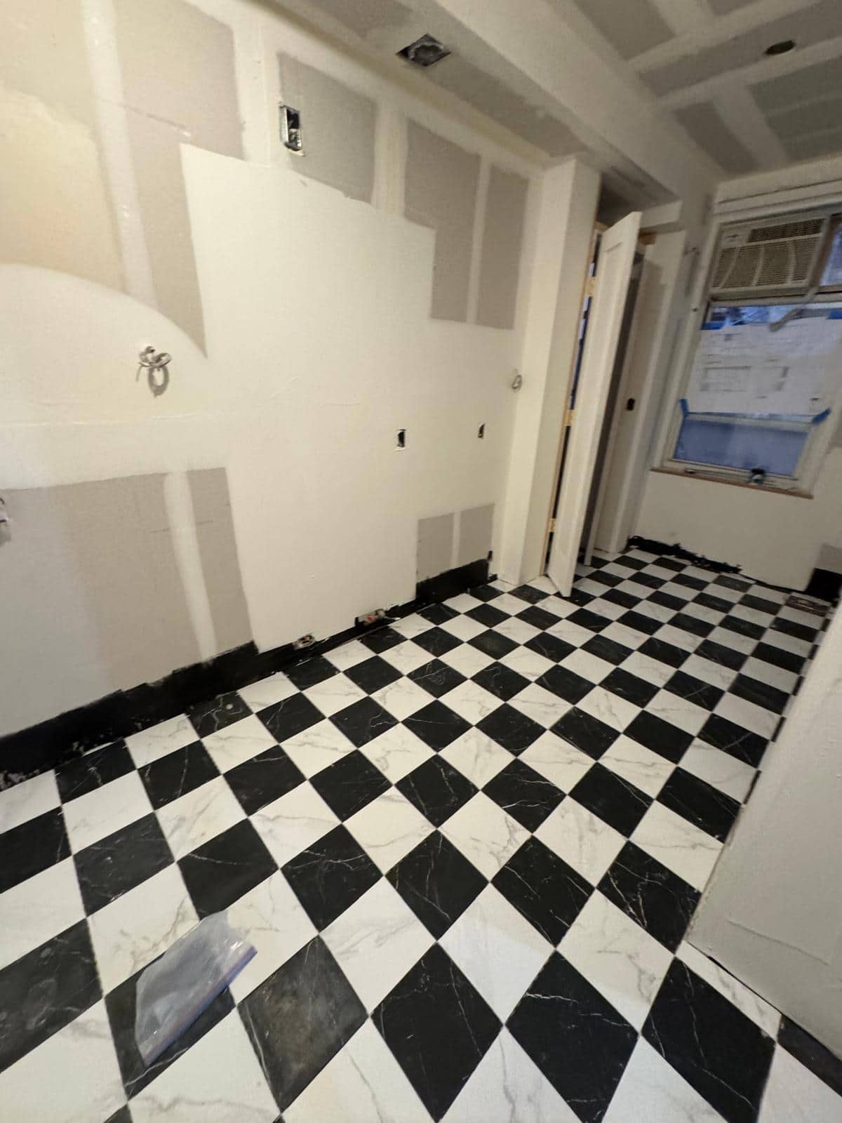 A closer angle on the black and white floor puts the perimeter cuts in view.